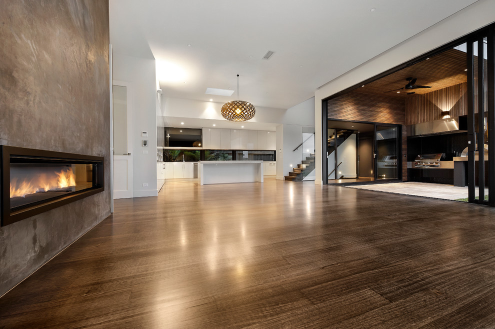 Contemporary games room in Melbourne with dark hardwood flooring.