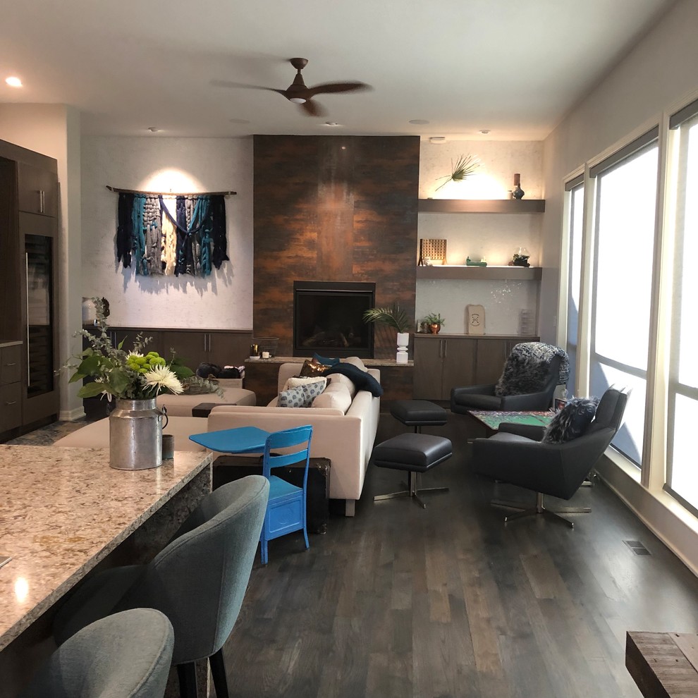 Inspiration for a large transitional open concept dark wood floor and gray floor family room remodel in Denver with a bar, gray walls, a standard fireplace, a tile fireplace and a wall-mounted tv