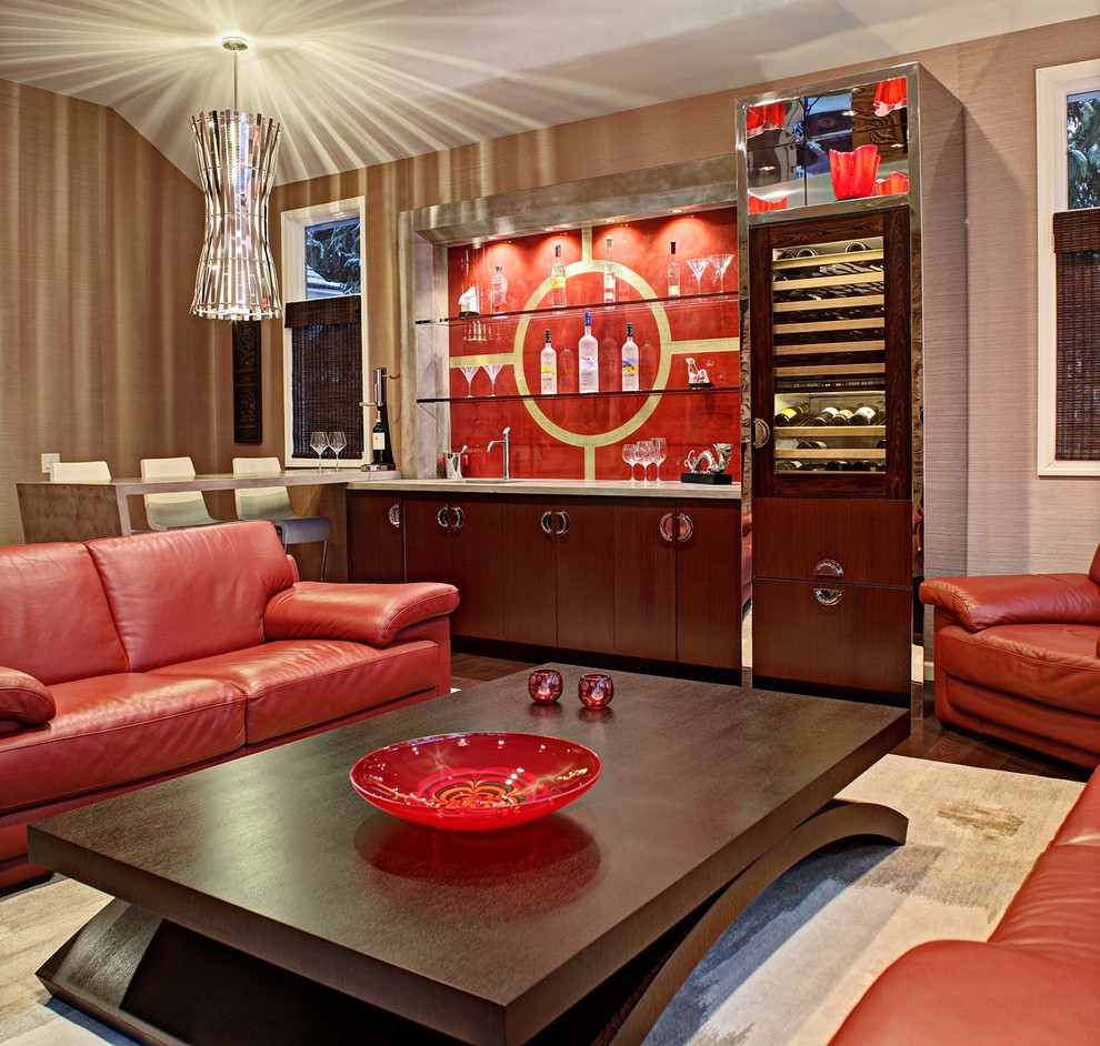 Family room - contemporary dark wood floor family room idea in New York with a bar and beige walls