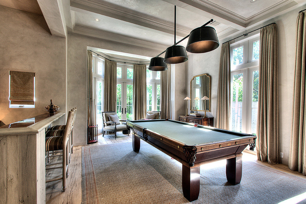 This is an example of a contemporary open plan games room in Houston with beige walls.