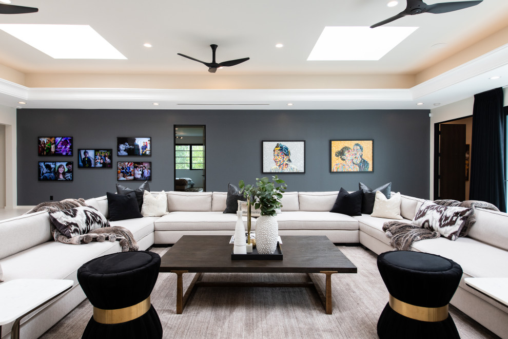 Contemporary games room in Orange County with grey walls and a drop ceiling.
