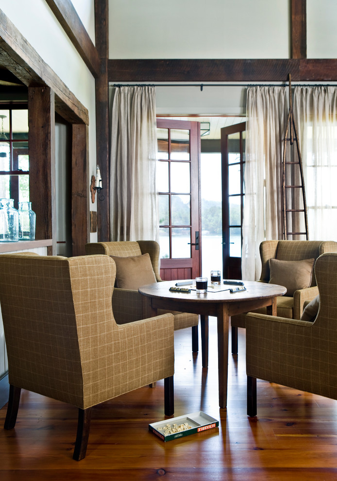 Mountain style open concept brown floor game room photo in Atlanta with white walls