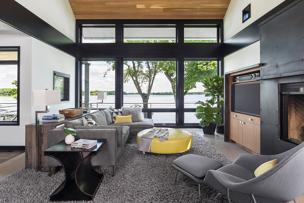 This is an example of a contemporary games room in Minneapolis with white walls and a built-in media unit.