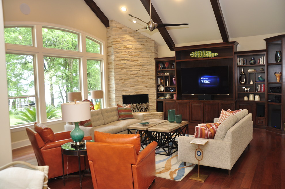 Inspiration for a large contemporary enclosed games room in Austin with beige walls, medium hardwood flooring, a corner fireplace, a stone fireplace surround and a built-in media unit.
