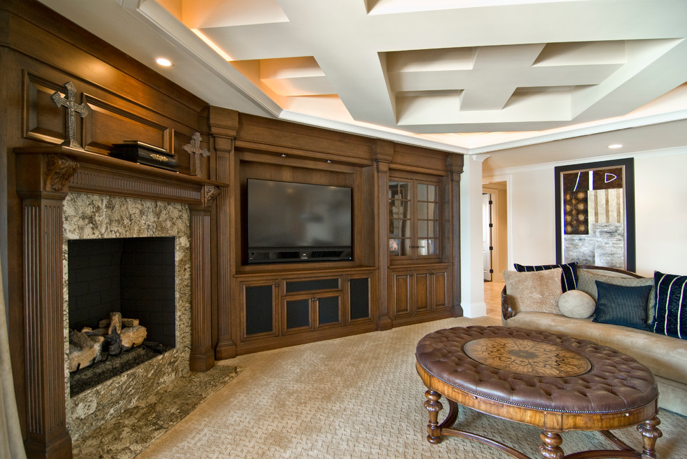 This is an example of a mediterranean enclosed games room in Charlotte with beige walls, carpet, a standard fireplace, a stone fireplace surround and a wall mounted tv.