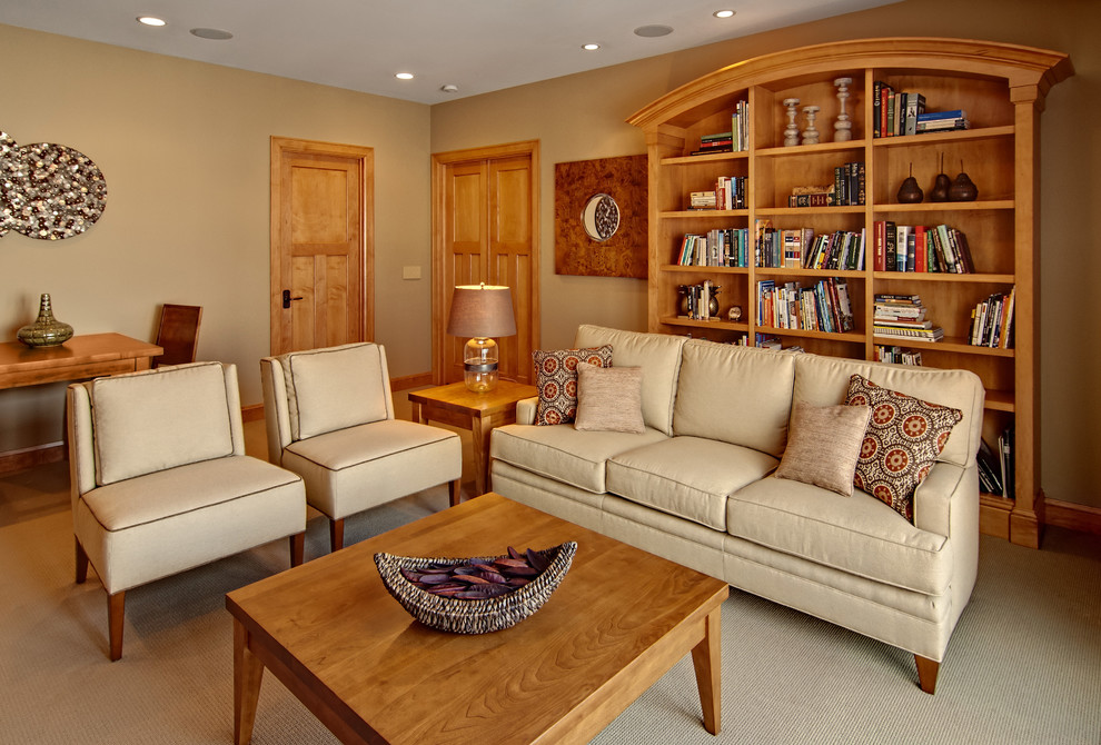 Example of a mid-sized transitional enclosed carpeted family room library design in Minneapolis with brown walls, a corner fireplace and a media wall