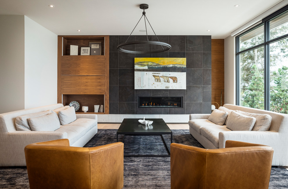 Design ideas for a large contemporary games room in Toronto with white walls, light hardwood flooring, a ribbon fireplace, a tiled fireplace surround and beige floors.
