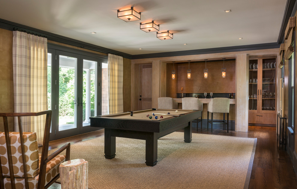 Example of a transitional enclosed medium tone wood floor family room design in Providence with beige walls, no fireplace and no tv