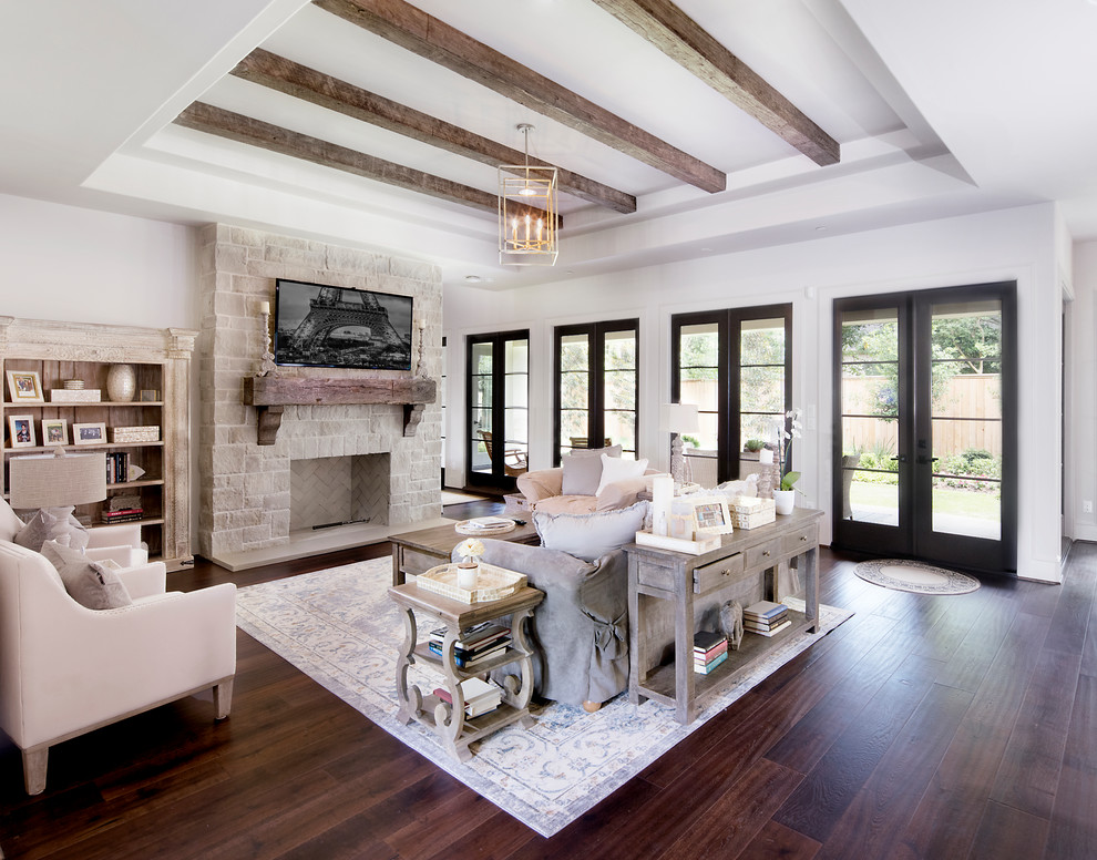 Huge elegant open concept dark wood floor and brown floor family room library photo in Houston with white walls, a standard fireplace, a stone fireplace and a wall-mounted tv