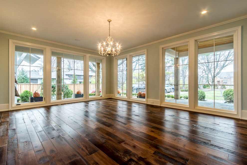 Large country open concept dark wood floor family room photo in Cleveland with green walls, no fireplace and no tv
