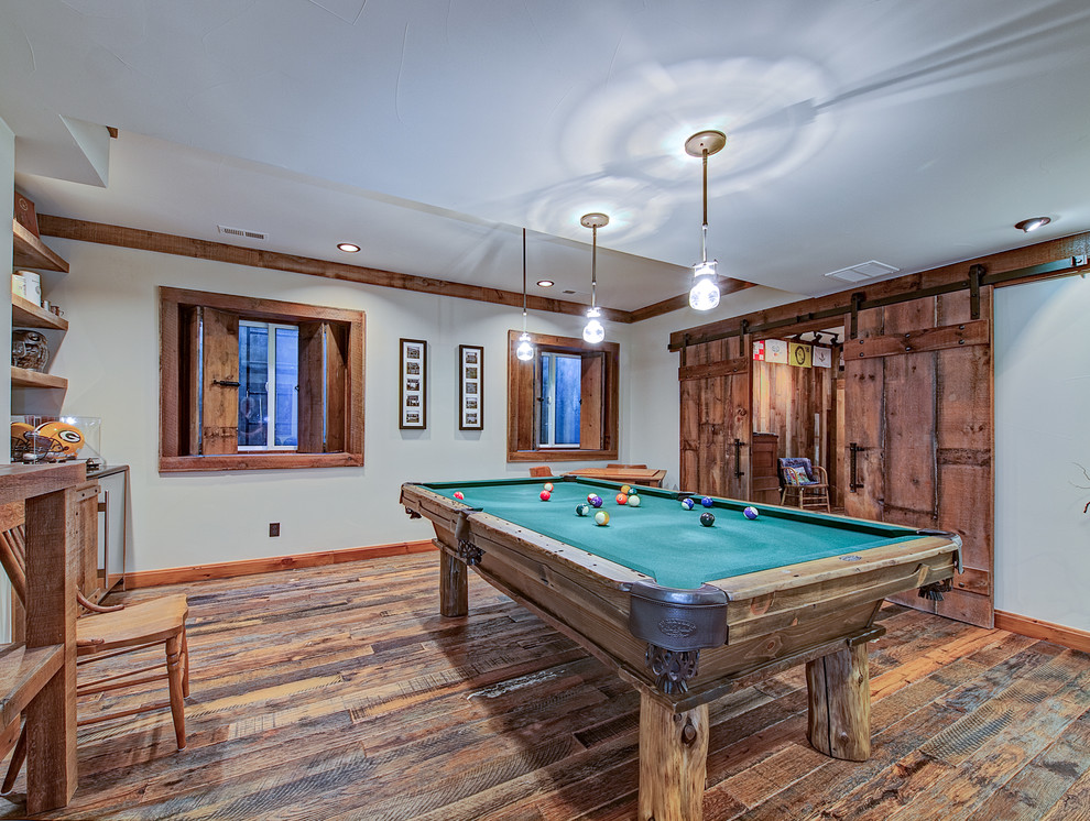 Photo of a traditional enclosed games room in Denver with white walls, medium hardwood flooring, no fireplace and no tv.