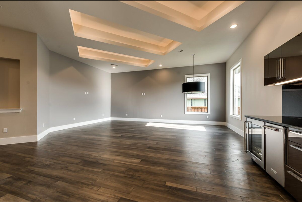 Design ideas for a large contemporary games room in Dallas with a game room, beige walls, dark hardwood flooring and a wall mounted tv.