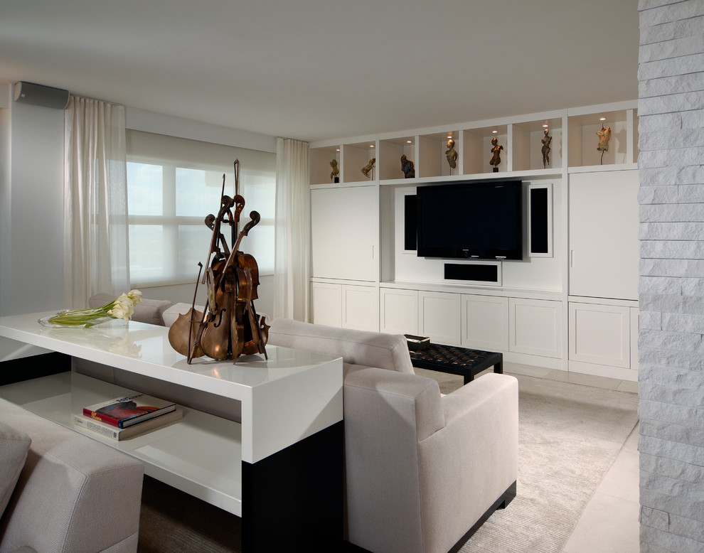 Example of a large trendy open concept carpeted and beige floor family room design in Miami with white walls, no fireplace and a media wall