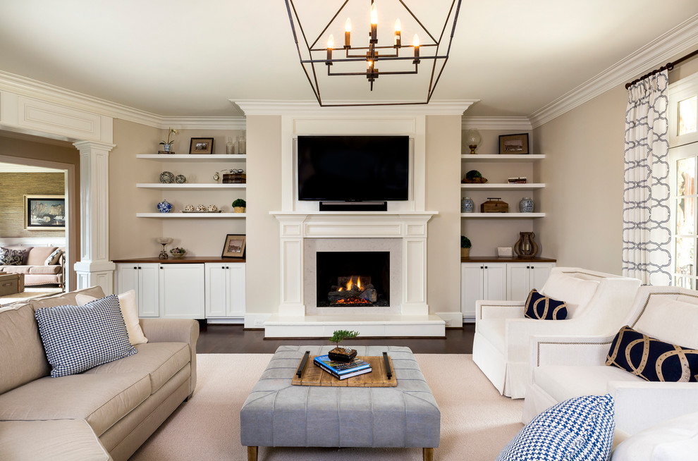 Inspiration for a timeless enclosed dark wood floor family room remodel in Charlotte with beige walls, a standard fireplace and a wall-mounted tv