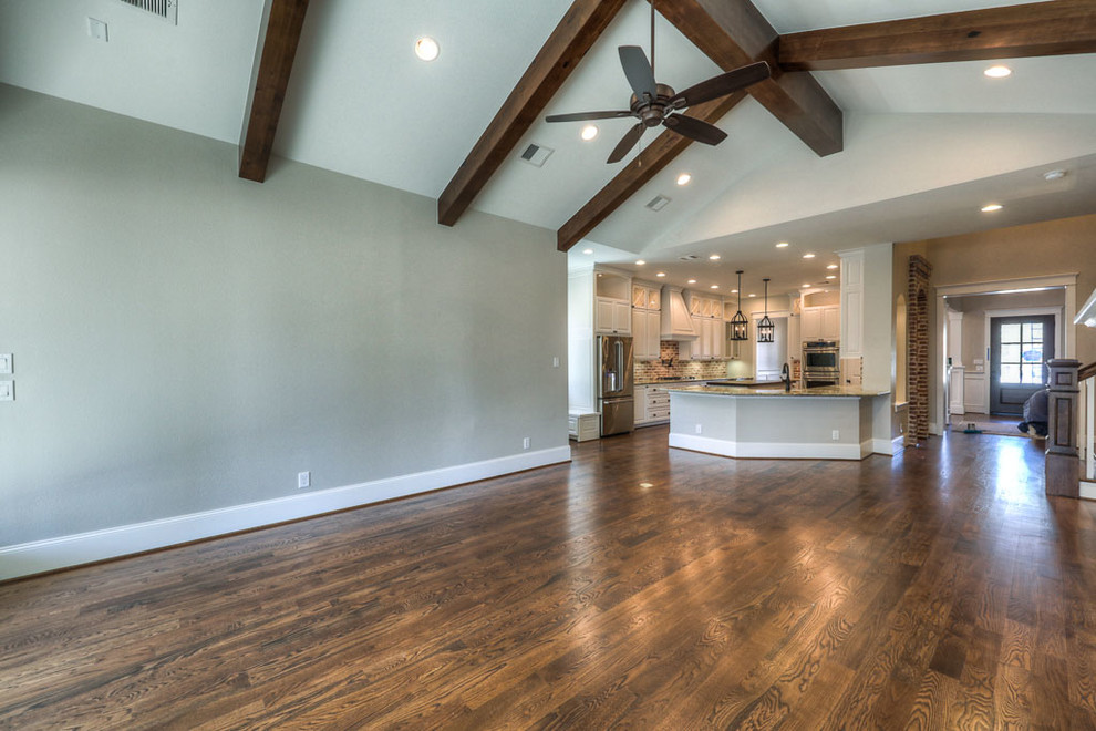 Photo of a large classic open plan games room in Houston with beige walls, dark hardwood flooring and no tv.