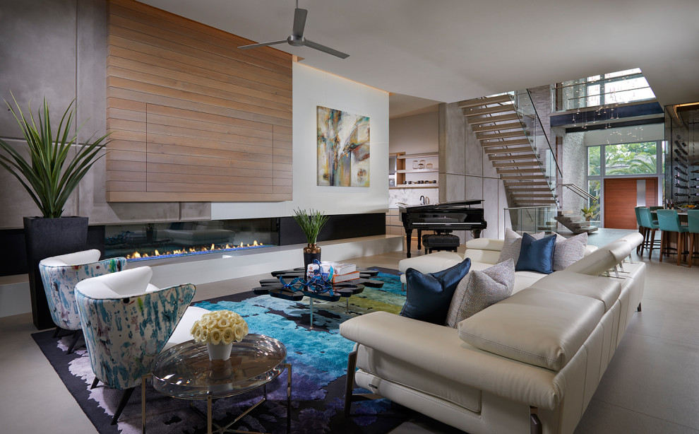 Идея дизайна: открытая гостиная комната в морском стиле с музыкальной комнатой, горизонтальным камином и серым полом