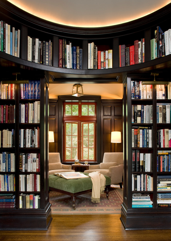 Inspiration for a large timeless enclosed dark wood floor and brown floor family room library remodel in New York with brown walls