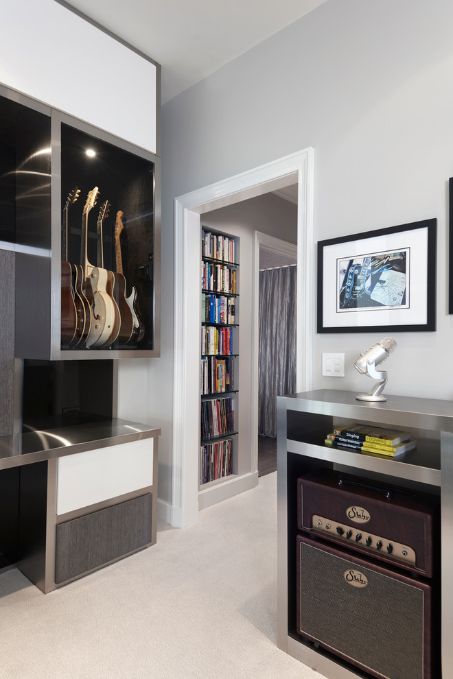 Example of a mid-sized trendy enclosed carpeted family room design in Chicago with a music area, gray walls and no fireplace