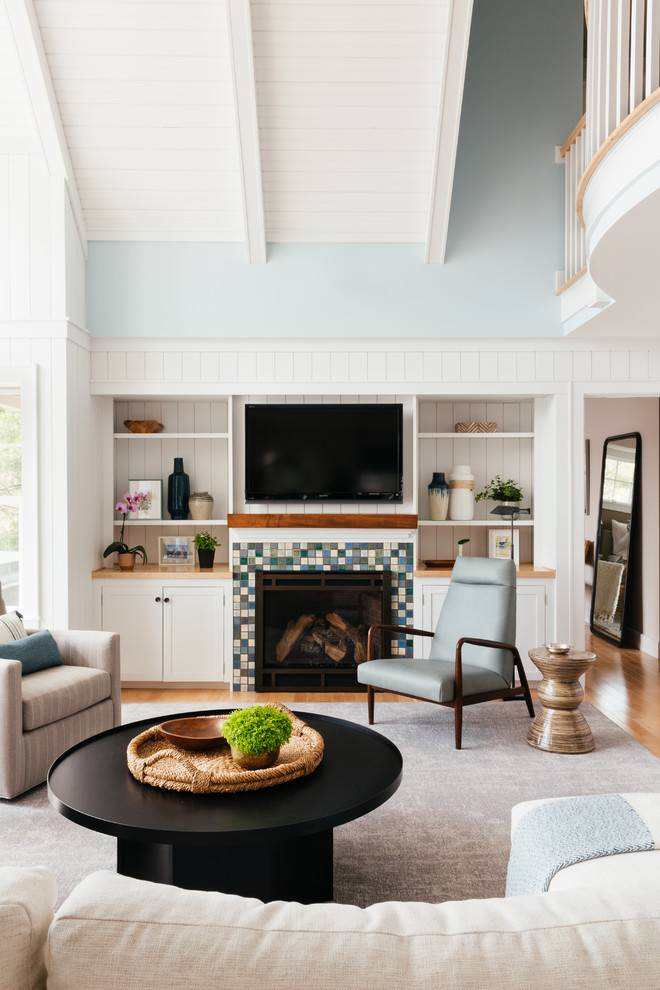 Inspiration for a large classic open plan games room in Bridgeport with white walls, carpet, a standard fireplace, a tiled fireplace surround and grey floors.