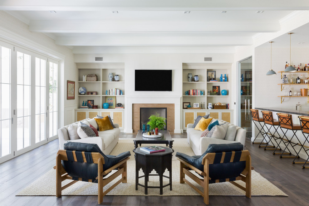 Large transitional open concept medium tone wood floor, brown floor, shiplap ceiling and wallpaper family room photo in Los Angeles with a bar, beige walls, a standard fireplace, a tile fireplace and a wall-mounted tv