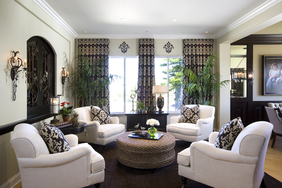 Elegant family room photo in San Diego with beige walls