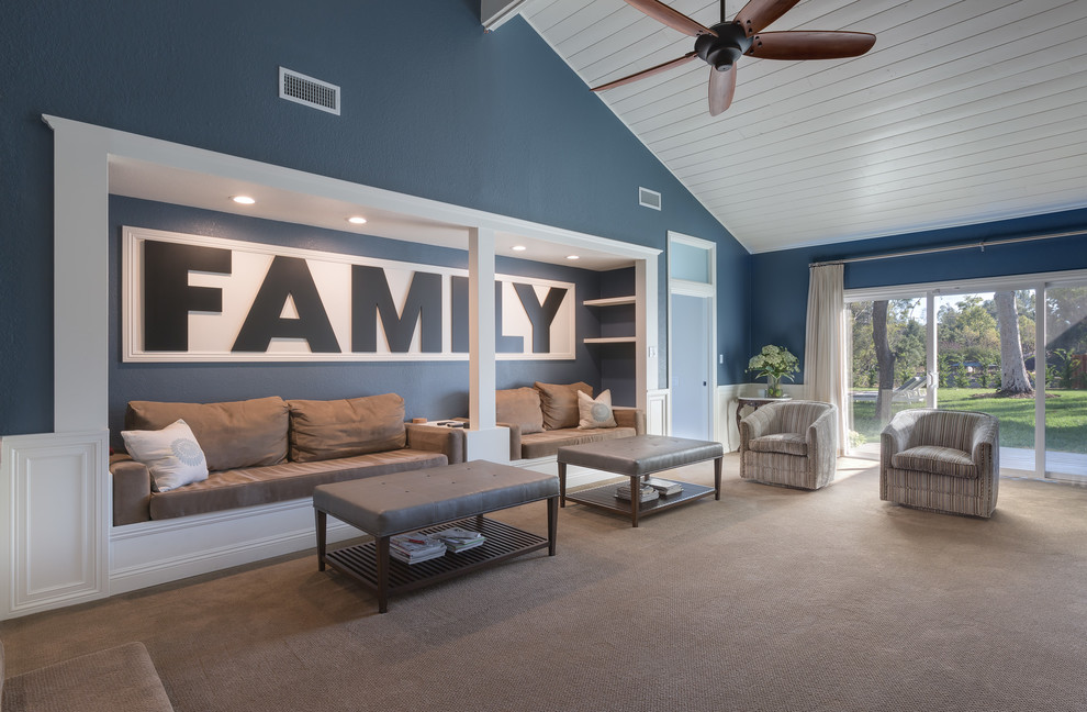 Family room - large craftsman enclosed carpeted and beige floor family room idea in Los Angeles with blue walls
