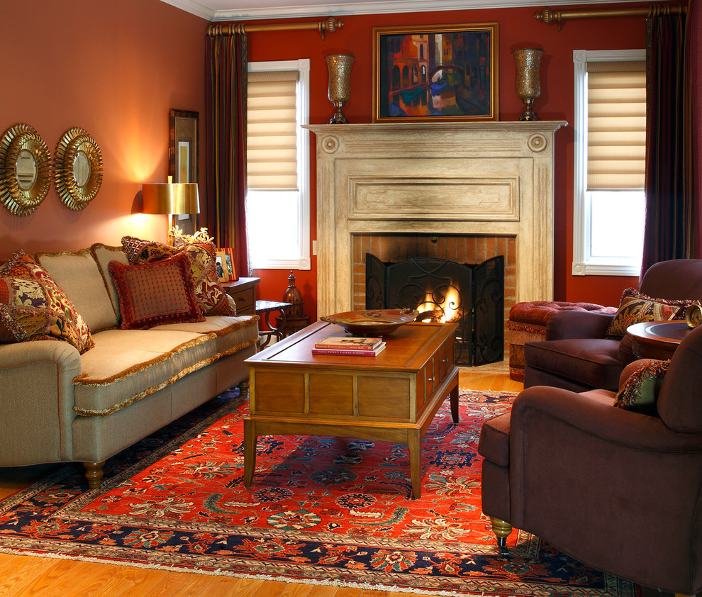 Classic games room in Toronto with a brick fireplace surround and red walls.