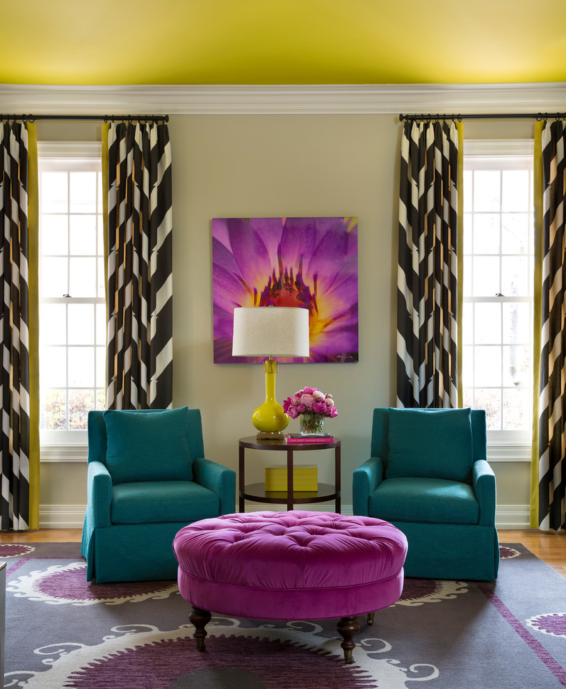 Inspiration for a large transitional light wood floor family room remodel in Little Rock with beige walls, a standard fireplace and a stone fireplace
