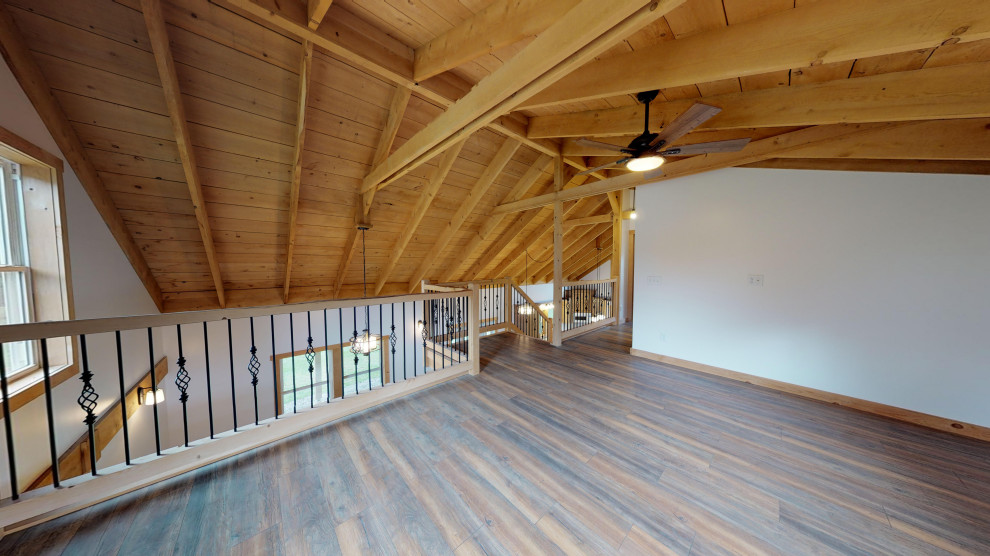 Idee per un soggiorno country di medie dimensioni e stile loft con pavimento in laminato e pavimento marrone