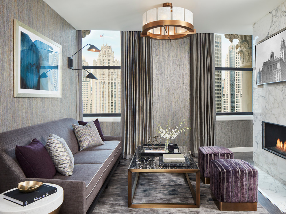 Идея дизайна: изолированная гостиная комната среднего размера в современном стиле с серыми стенами, мраморным полом, стандартным камином, фасадом камина из камня, телевизором на стене и белым полом