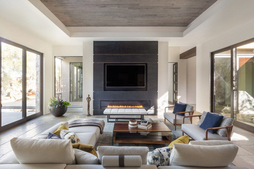 Inspiration for a contemporary open plan games room in Sacramento with white walls, a ribbon fireplace, a built-in media unit and beige floors.