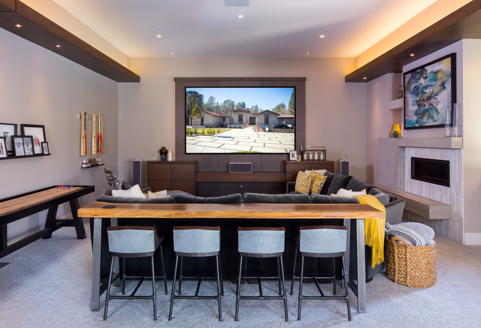 Inspiration for a medium sized contemporary open plan games room in Sacramento with a game room, beige walls, carpet, a ribbon fireplace, a tiled fireplace surround, a built-in media unit and grey floors.