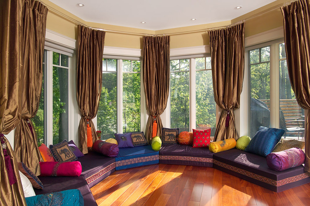 Family room - huge zen open concept medium tone wood floor and orange floor family room idea in Toronto with beige walls