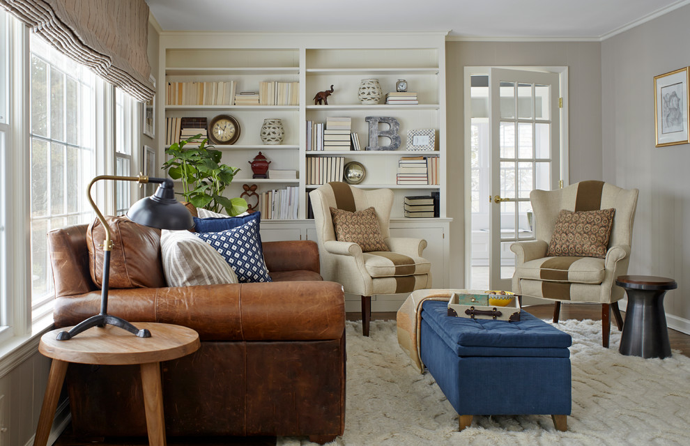 Family room - traditional enclosed dark wood floor family room idea in New York with gray walls