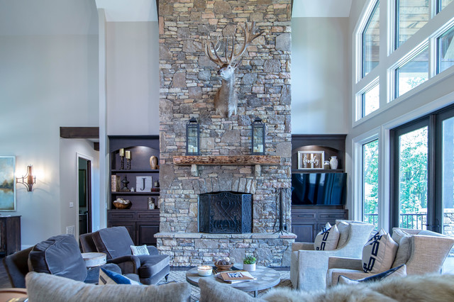 Luxurious Great Room With Stone, Custom Built Ins Around Fireplace