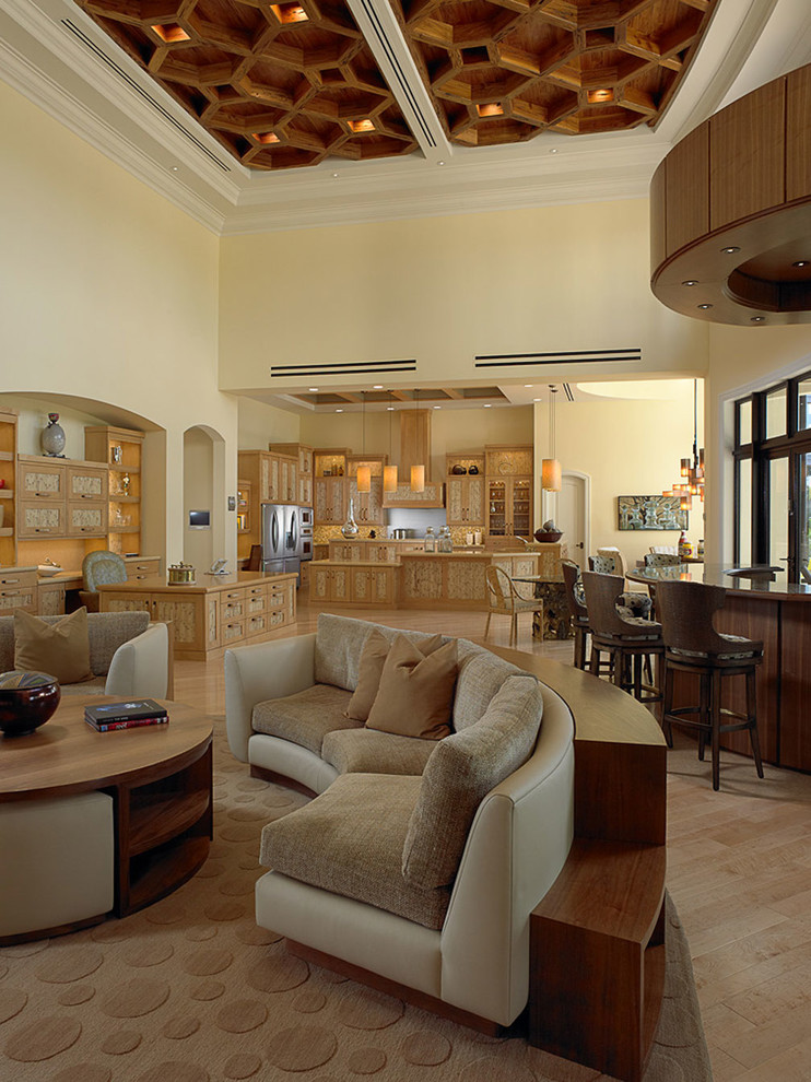 Example of a huge tuscan open concept light wood floor family room design in Miami with a bar, beige walls and no fireplace