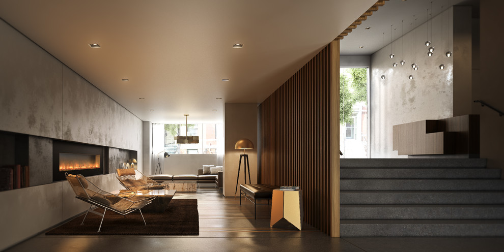 Cette image montre une grande salle de séjour design ouverte avec un mur gris, sol en béton ciré, une cheminée standard et un manteau de cheminée en métal.