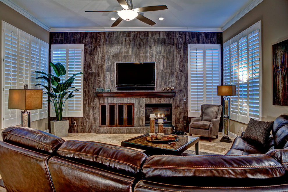 Mid-sized trendy open concept porcelain tile family room photo in Las Vegas with beige walls, a standard fireplace, a tile fireplace and a wall-mounted tv