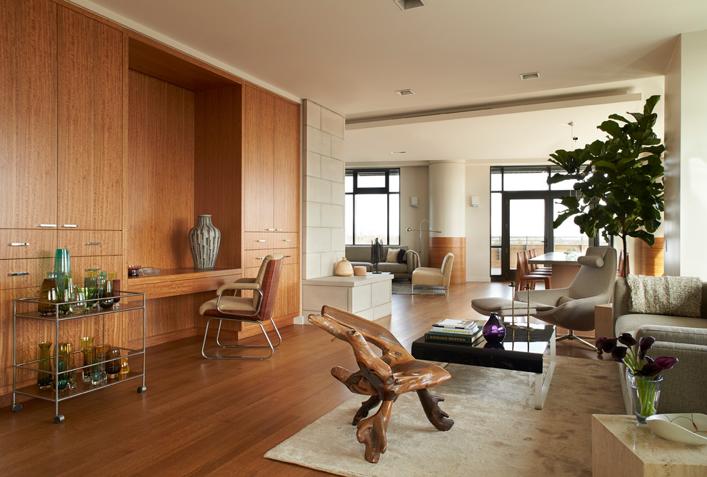 Идея дизайна: гостиная комната в современном стиле с паркетным полом среднего тона