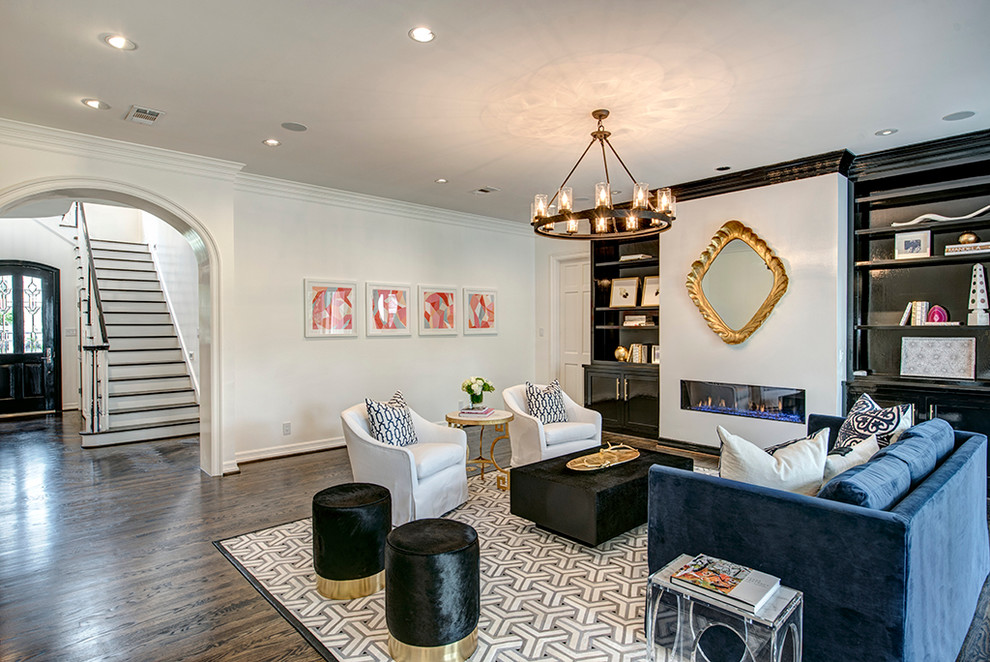 Ejemplo de sala de estar abierta contemporánea grande con paredes blancas, suelo de madera en tonos medios y todas las chimeneas