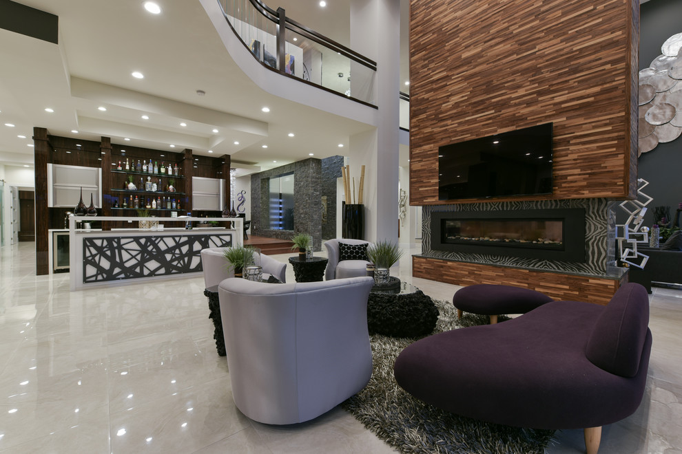 Стильный дизайн: открытая гостиная комната в стиле модернизм с телевизором на стене - последний тренд