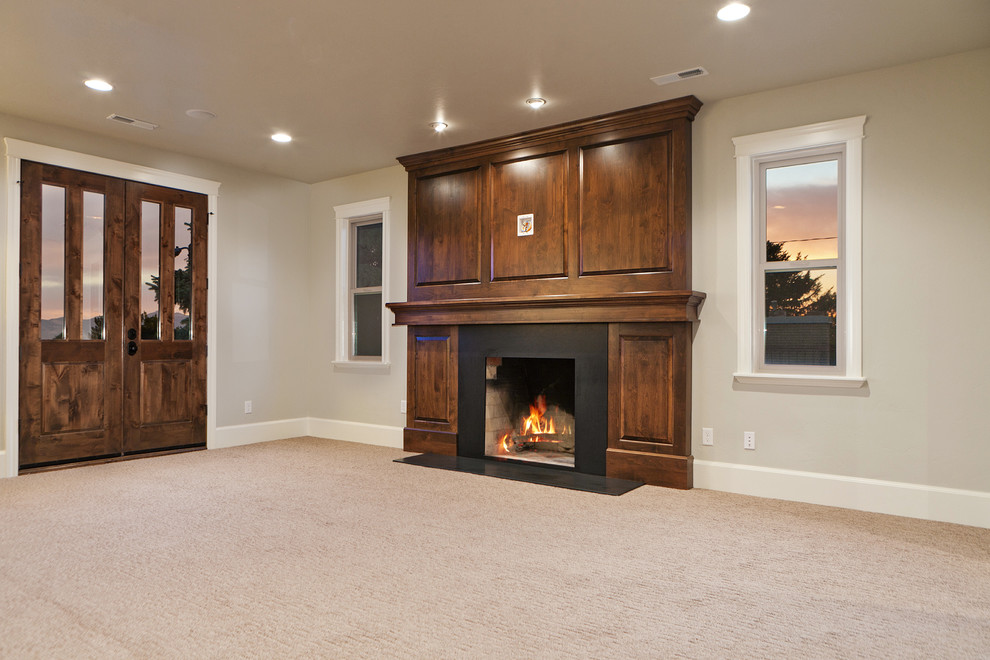 Large elegant open concept medium tone wood floor family room photo in Salt Lake City with gray walls, a standard fireplace and a metal fireplace