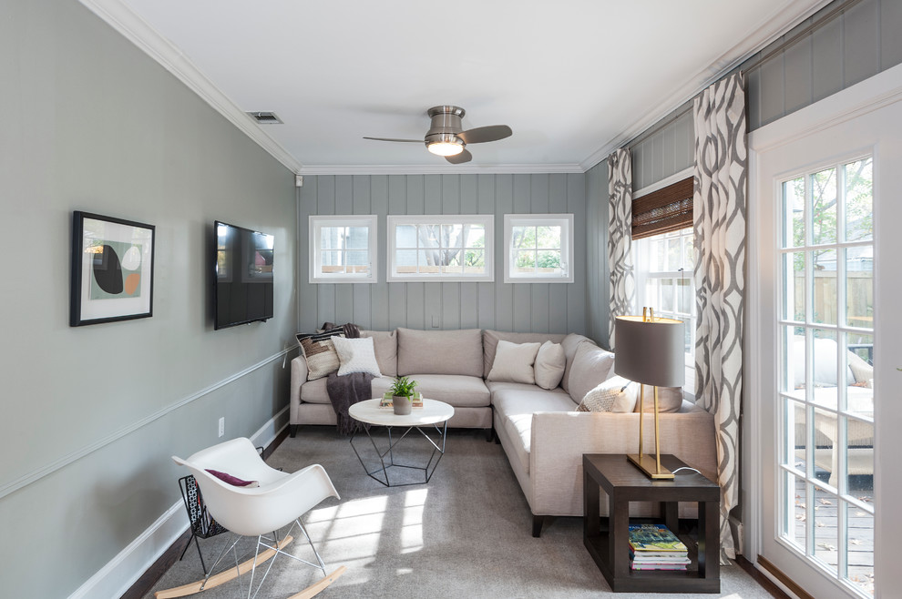 Example of a transitional family room design in Dallas with blue walls, no fireplace and a wall-mounted tv