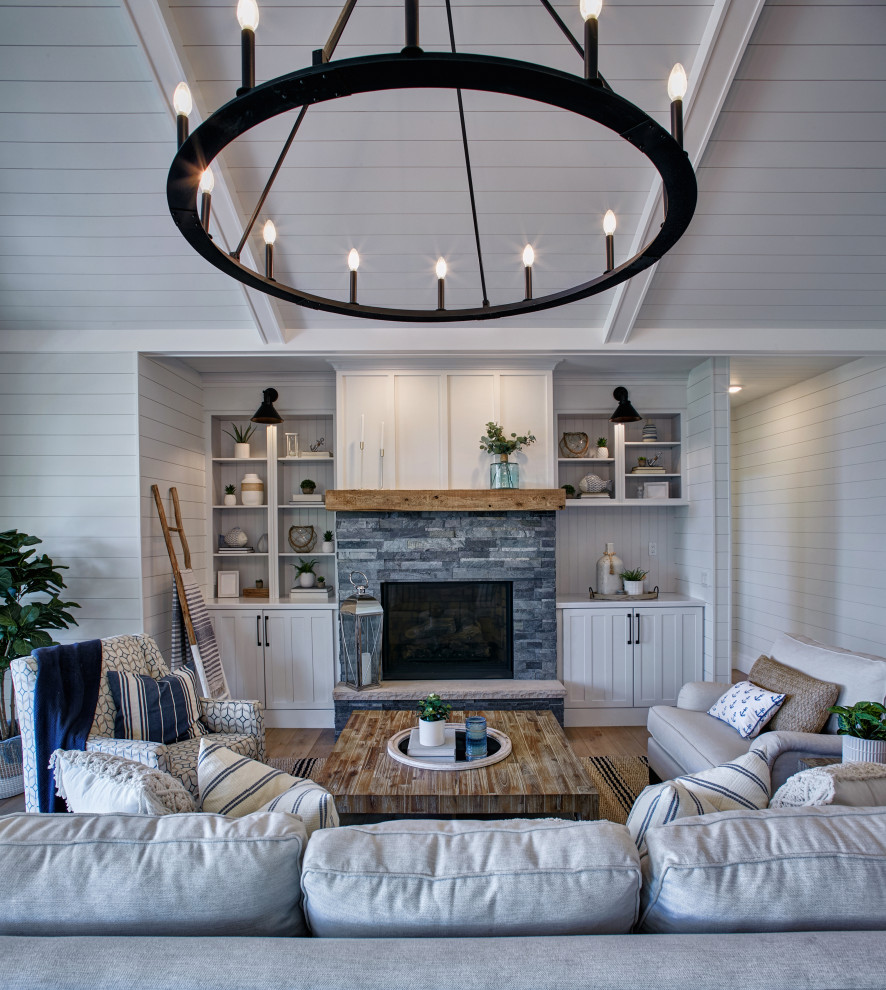 Example of a beach style family room design in Other