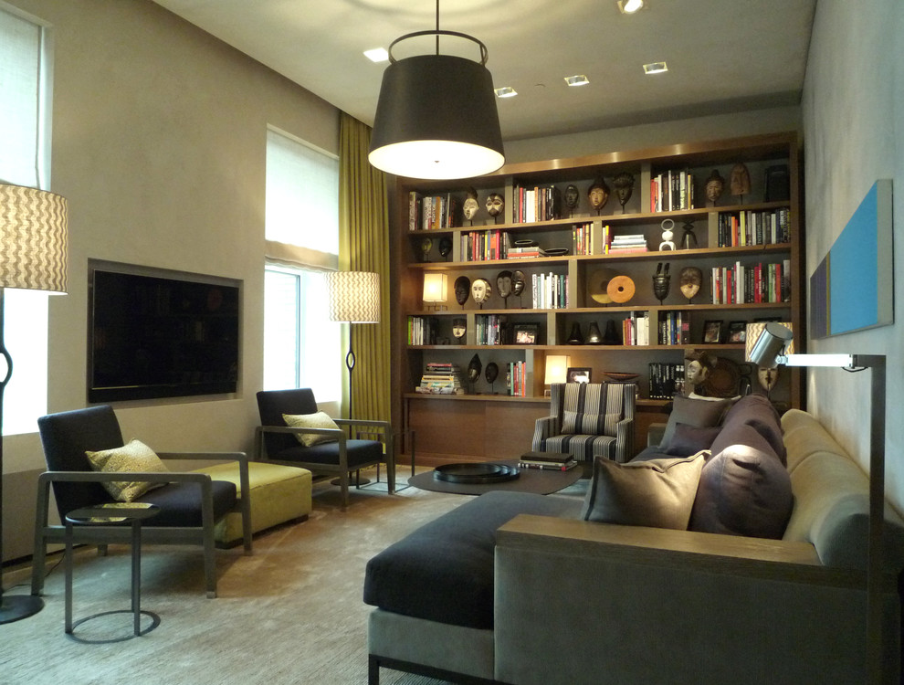 Aménagement d'une salle de séjour contemporaine avec une bibliothèque ou un coin lecture.