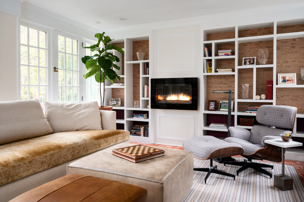 Inspiration for a mid-sized transitional enclosed terra-cotta tile and red floor family room library remodel in Philadelphia with white walls and a ribbon fireplace