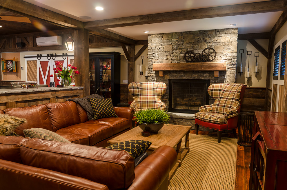 Medium sized country open plan games room in New York with beige walls, dark hardwood flooring, a standard fireplace, a stone fireplace surround and a wall mounted tv.