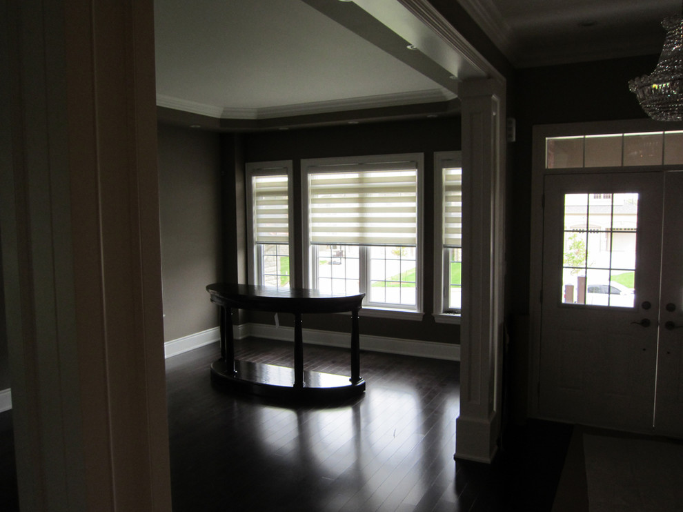 Mid-sized trendy dark wood floor family room photo in Toronto with beige walls