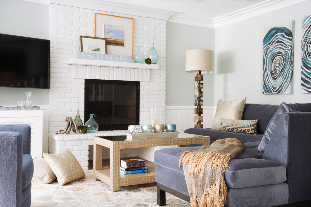 Family room - coastal family room idea in Los Angeles with gray walls, a standard fireplace, a brick fireplace and a wall-mounted tv