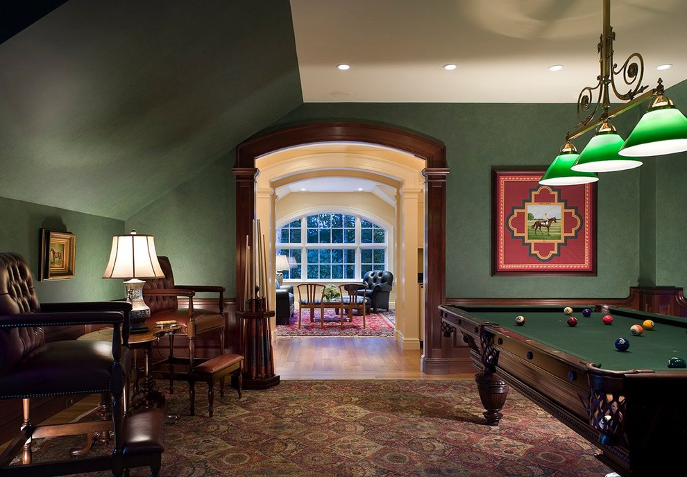 Classic enclosed games room in Boston with green walls.